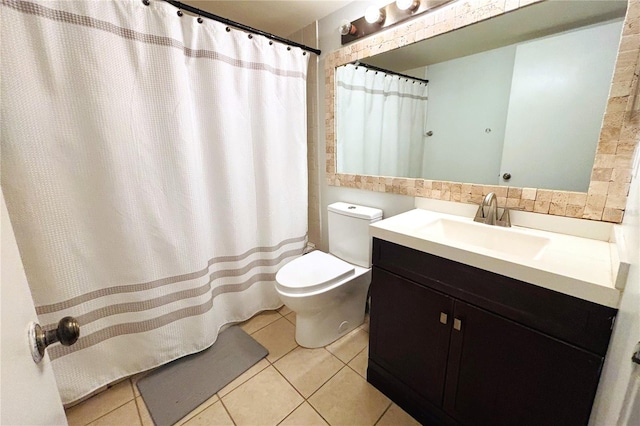 bathroom with a shower with curtain, tile patterned flooring, vanity, and toilet