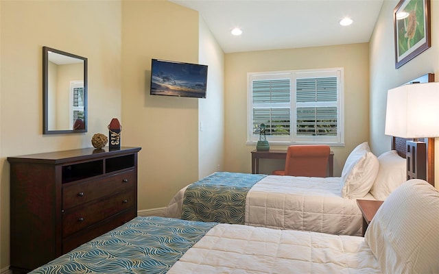 bedroom with vaulted ceiling and carpet flooring