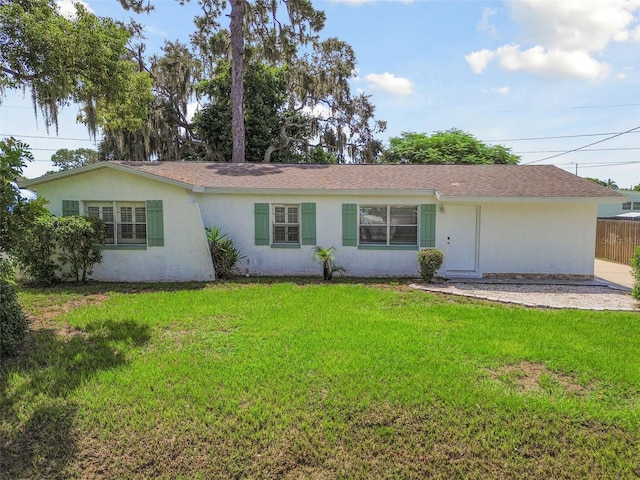 single story home featuring a front yard