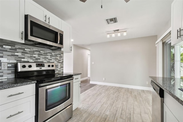 kitchen featuring light hardwood / wood-style flooring, stainless steel appliances, and white cabinets