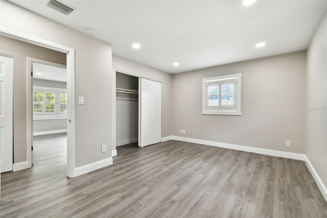 unfurnished bedroom featuring light hardwood / wood-style floors