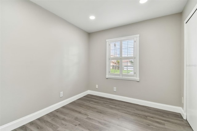 unfurnished room featuring hardwood / wood-style floors