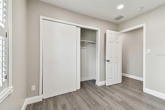 interior space featuring light hardwood / wood-style flooring and a closet