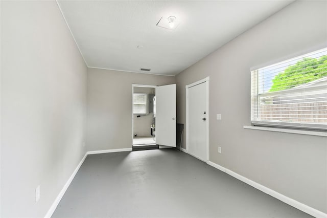 spare room featuring concrete floors