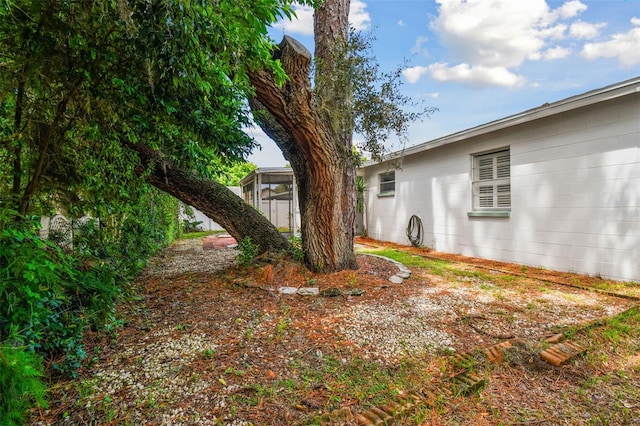 view of yard with a sunroom