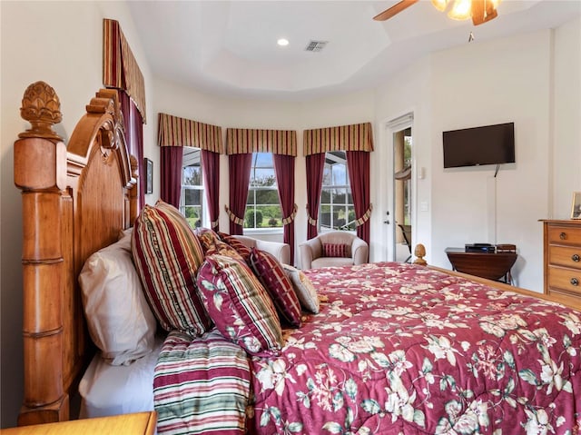 bedroom featuring recessed lighting, visible vents, a raised ceiling, and a ceiling fan