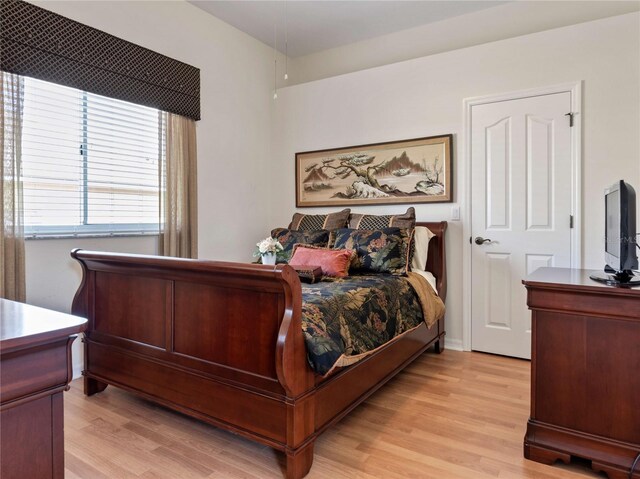 bedroom with light wood-style flooring