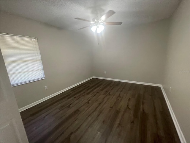 spare room featuring a textured ceiling, dark hardwood / wood-style flooring, and ceiling fan