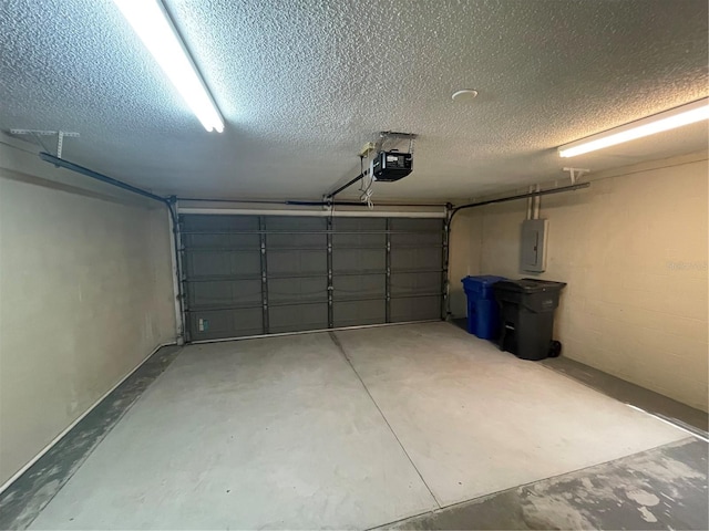 garage featuring electric panel and a garage door opener