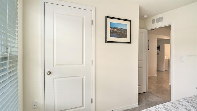 unfurnished bedroom featuring light colored carpet