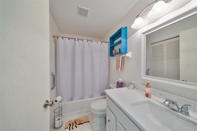 full bathroom with tile patterned floors, vanity, toilet, and shower / bath combo with shower curtain