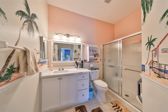 bathroom featuring vanity, a shower with shower door, a textured ceiling, and toilet