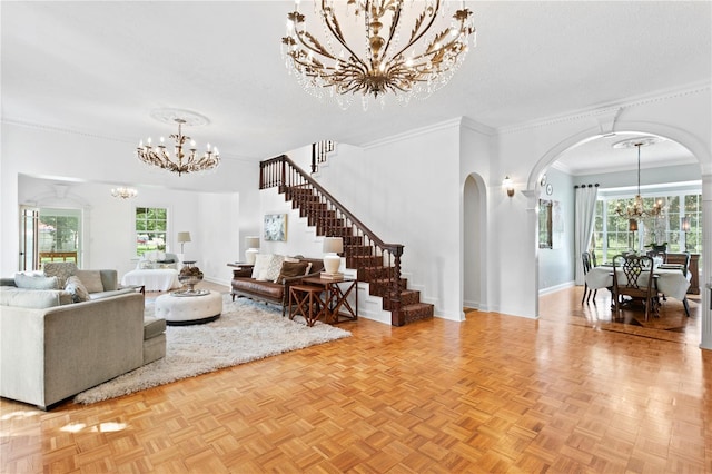 living room featuring a textured ceiling, crown molding, light parquet flooring, and a healthy amount of sunlight