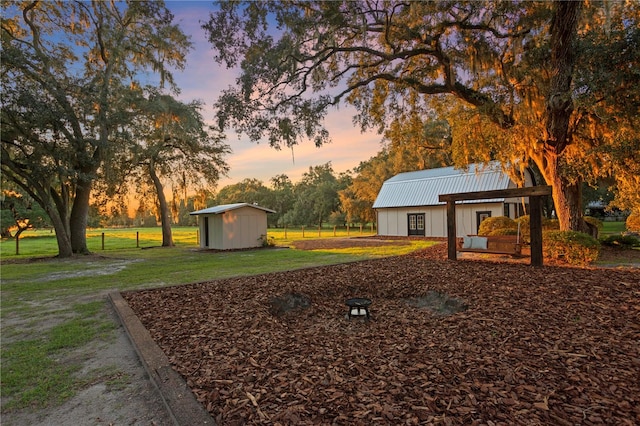 yard at dusk with a shed