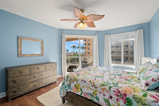 bedroom with dark wood-type flooring, access to exterior, and ceiling fan