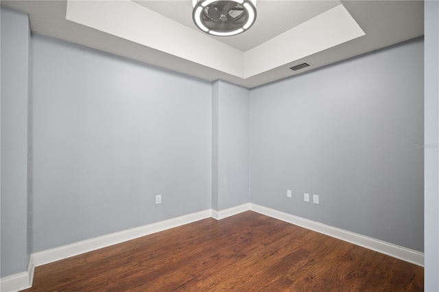 empty room with hardwood / wood-style flooring