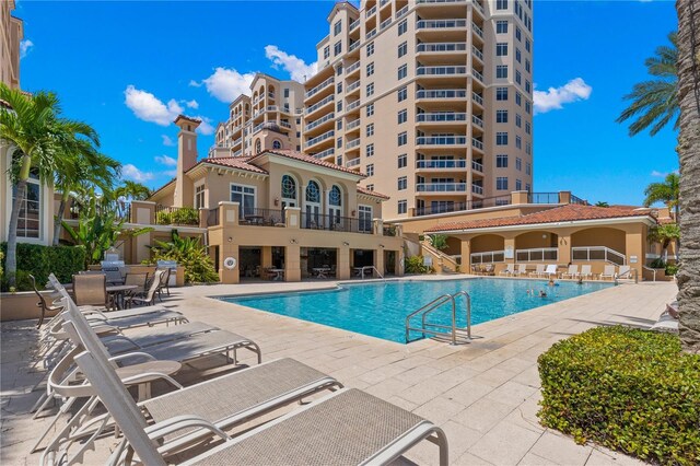 view of swimming pool with a patio area