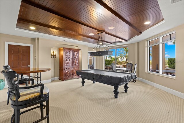 game room featuring a tray ceiling, billiards, wood ceiling, and light colored carpet