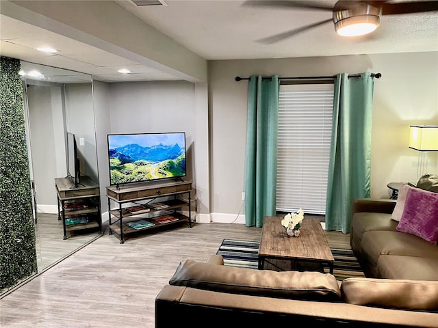 1478 Alternate Keene Rd, Largo, FL 33771 - living area featuring baseboards, visible vents, ceiling fan, and wood finished floors