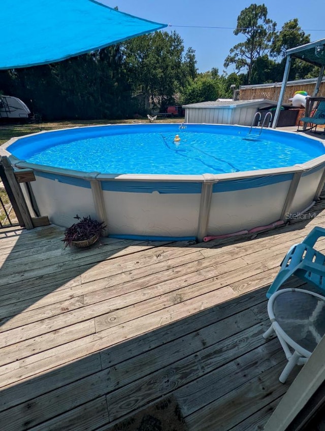 view of pool with a deck