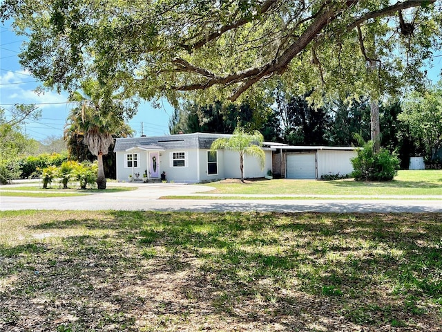 1478 Alternate Keene Rd, Largo, FL 33771 - view of front of property featuring an attached garage and a front yard