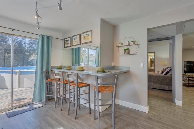 kitchen with hardwood / wood-style flooring and a breakfast bar