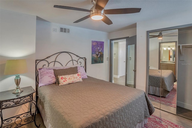 1478 Alternate Keene Rd, Largo, FL 33771 - bedroom with a closet, visible vents, ceiling fan, wood finished floors, and a sink