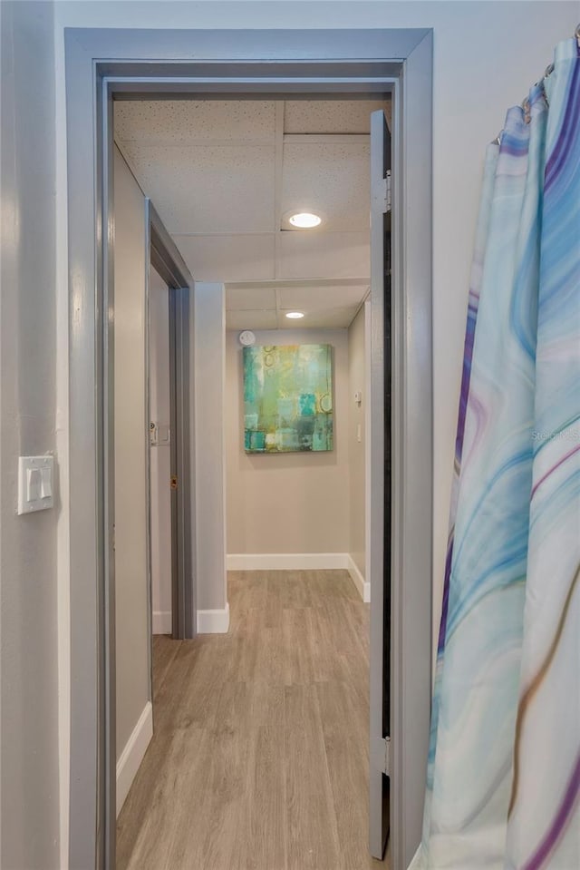 1478 Alternate Keene Rd, Largo, FL 33771 - hallway featuring baseboards, light wood-style flooring, and a drop ceiling