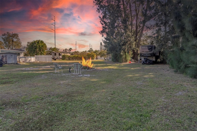 view of yard at dusk