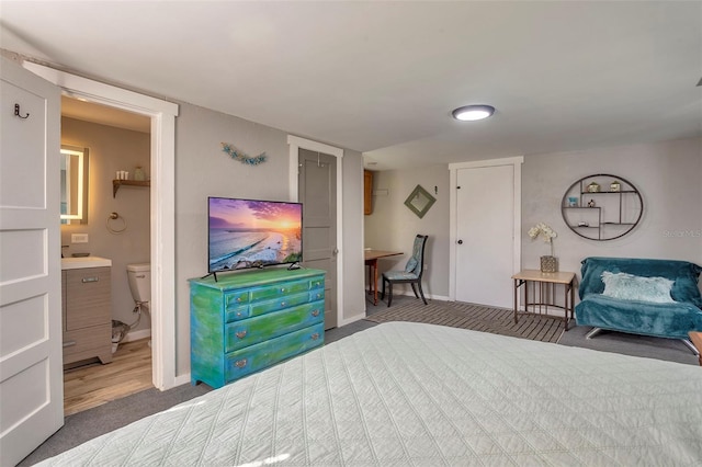 carpeted bedroom with ensuite bathroom