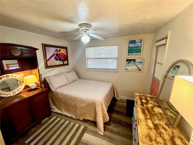 1478 Alternate Keene Rd, Largo, FL 33771 - bedroom featuring a textured ceiling, baseboards, ceiling fan, and wood finished floors
