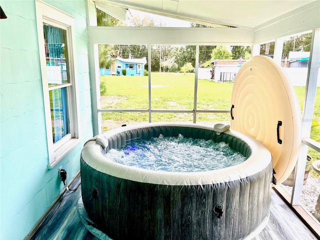 1478 Alternate Keene Rd, Largo, FL 33771 - sunroom featuring a jacuzzi