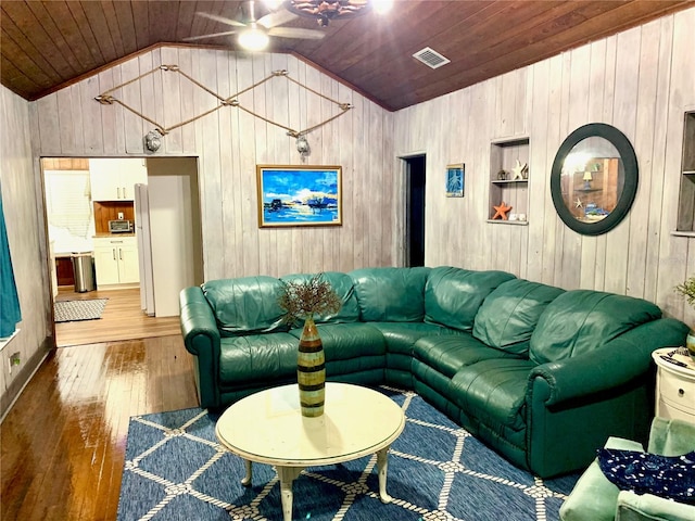 living room featuring wood ceiling, ceiling fan, dark hardwood / wood-style floors, and wooden walls