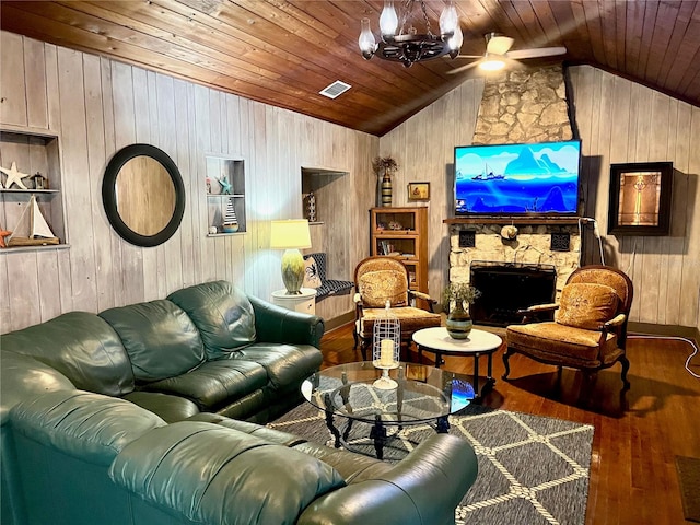 living room with wooden walls, ceiling fan with notable chandelier, wood ceiling, lofted ceiling, and wood-type flooring