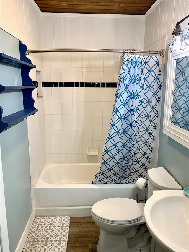 1478 Alternate Keene Rd, Largo, FL 33771 - full bathroom featuring toilet, a sink, shower / tub combo with curtain, and wood finished floors