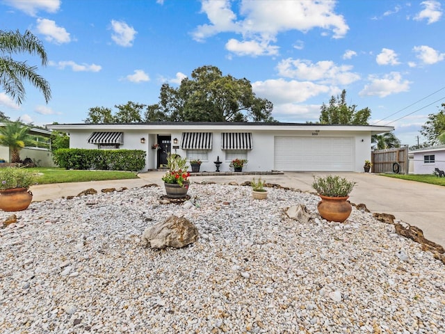 single story home featuring a garage