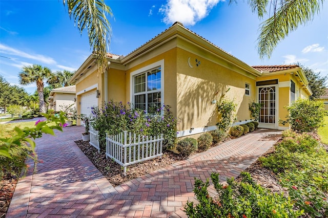 view of property exterior with a garage