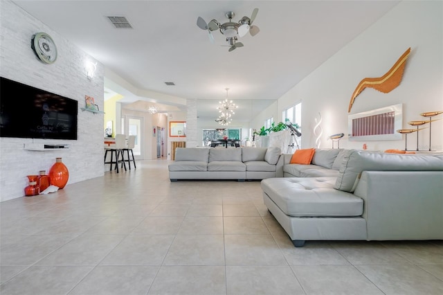 living room with light tile patterned floors and a notable chandelier