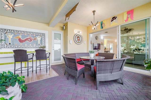 dining area featuring an inviting chandelier