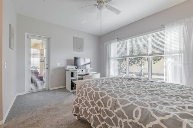 bedroom with multiple windows, access to outside, ceiling fan, and carpet floors