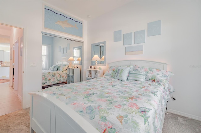 bedroom featuring light colored carpet