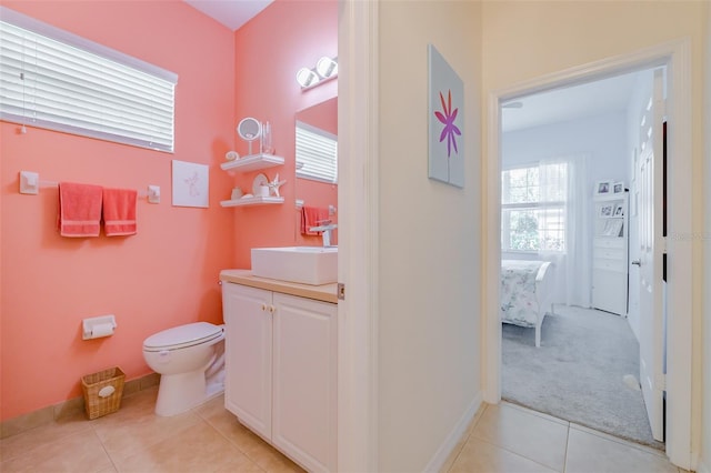 bathroom featuring vanity, toilet, and tile patterned floors