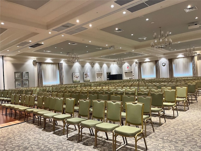 cinema featuring carpet, an inviting chandelier, coffered ceiling, and beam ceiling