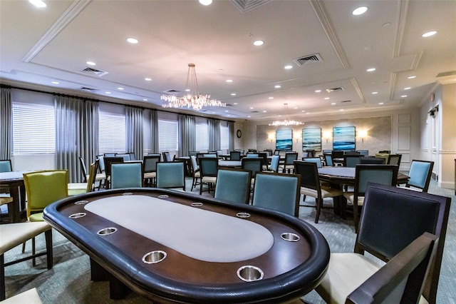 recreation room with crown molding, an inviting chandelier, and carpet floors