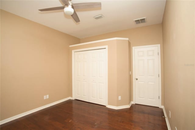 unfurnished bedroom featuring a closet, ceiling fan, and hardwood / wood-style flooring