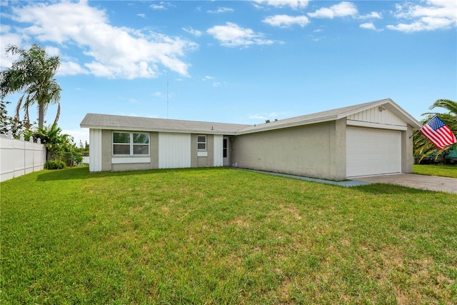 ranch-style home featuring a garage and a front lawn