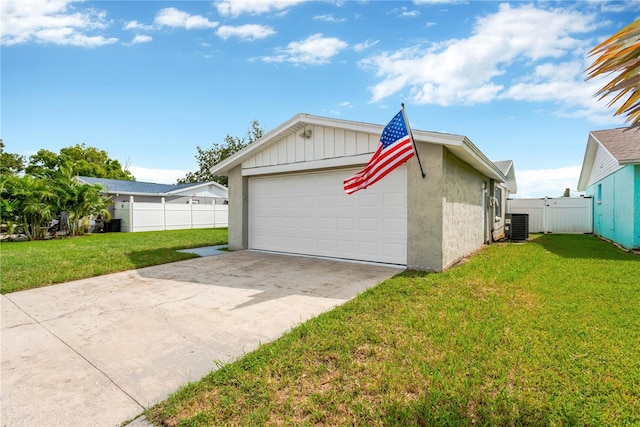 view of property exterior with a yard and central AC