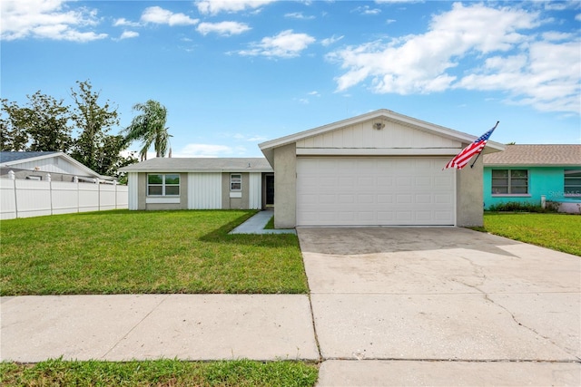 ranch-style house featuring a garage and a front lawn