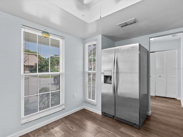 kitchen featuring dark hardwood / wood-style floors and stainless steel refrigerator with ice dispenser