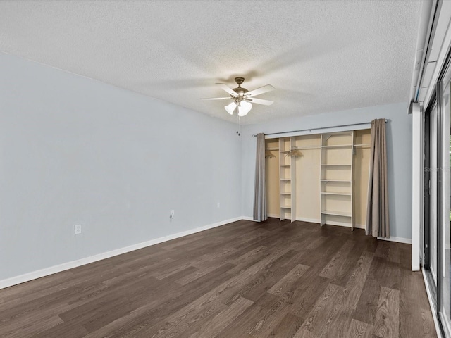 unfurnished bedroom featuring a textured ceiling, dark wood-type flooring, ceiling fan, and a closet